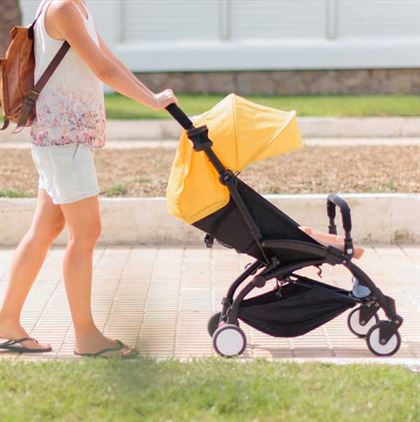 Young mom pushing stroller Mockups