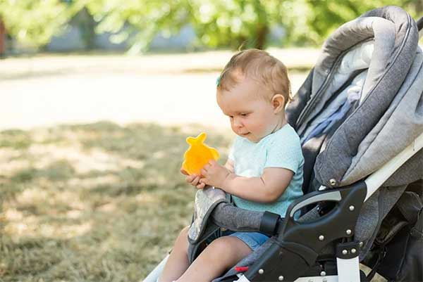 Baby sitting in stroller Mockups